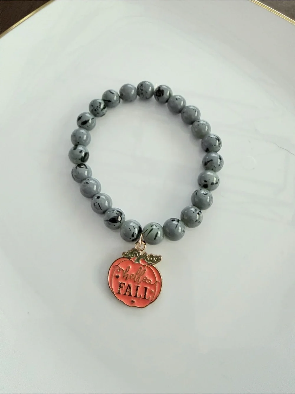 Gray Beaded Stretch Bracelet with Orange Pumpkin Charm